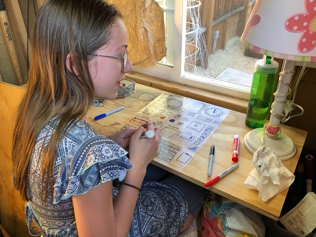 Ellie and Owen set up a play space in the shed