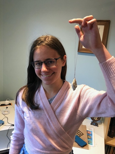 Lela with a rock pendant