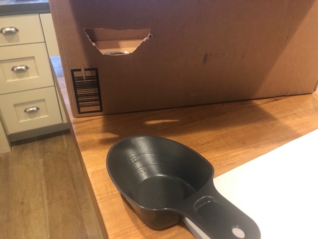 Hole and scoop for delivering food