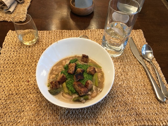 Bean stew with asparatus and fresh herb pesto