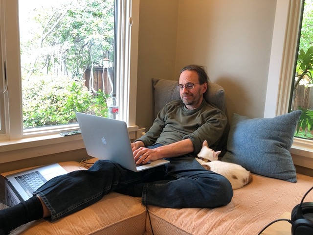 Mike in his window seat with the new pillows!  Opens up a more comfortable possibility
