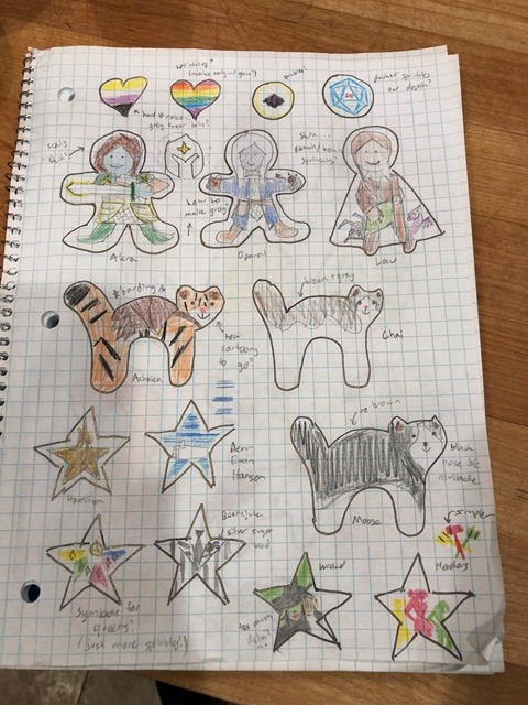 Owen drawing cat cookies