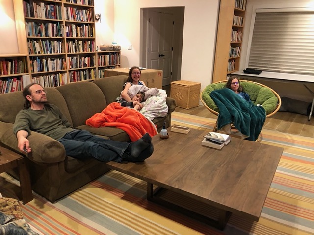 Famil in the living room for a movie