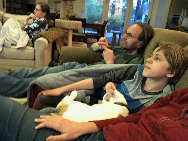 Gizmo snuggling with Owen
