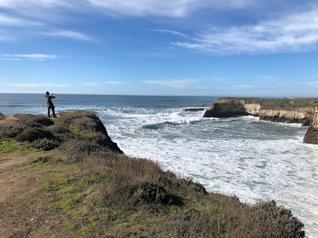 MIke taking a picture on a bluff