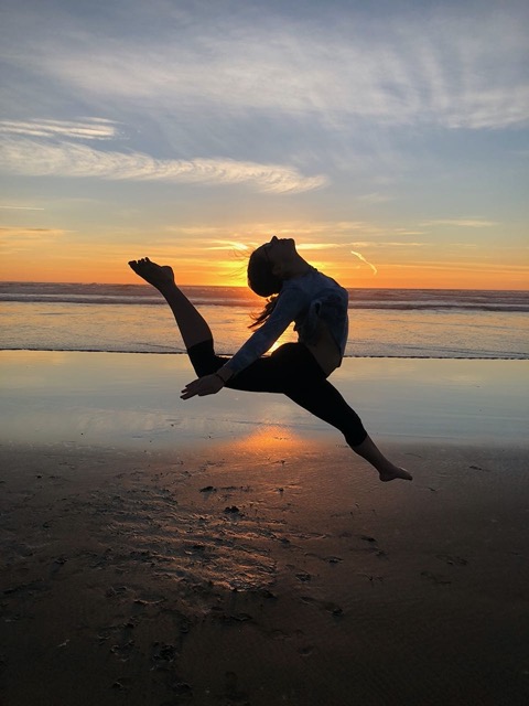 Lela doing a firebird jump