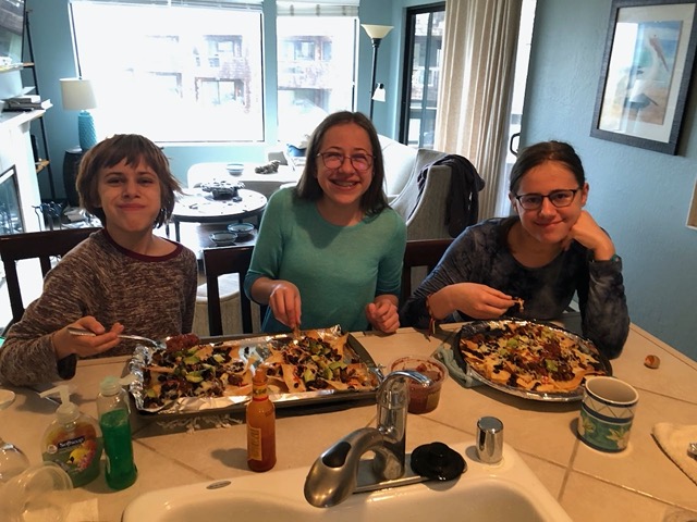 The kids eating nachos for lunch